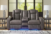 Ashley Furniture Fyne-Dyme power reclining loveseat with built-in console, featuring plush upholstery and reclining seats.
