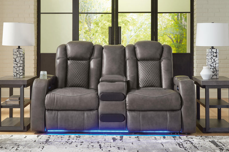 Ashley Furniture Fyne-Dyme power reclining loveseat with built-in console, featuring plush upholstery and reclining seats.