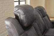 Ashley Furniture Fyne-Dyme power reclining loveseat with built-in console, featuring plush cushions and a sleek design.