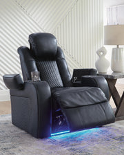 Ashley Furniture Fyne-Dyme Power Recliner in dark brown fabric with plush cushions and built-in reclining mechanism.