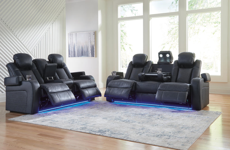 Ashley Furniture Fyne-Dyme living room set with sofa and armchairs in a modern design, shown in a cozy living room setting.