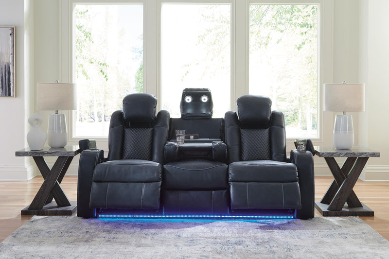 Ashley Furniture Fyne-Dyme Power Reclining Sofa with plush cushions and reclining features, shown in a modern living room setting.