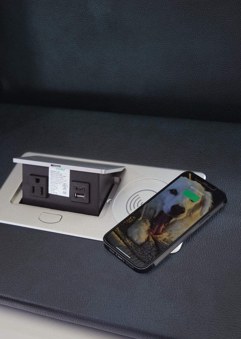 Close-up of the Ashley Furniture Fyne-Dyme living room set showing wireless charging detail on the sofa arm.