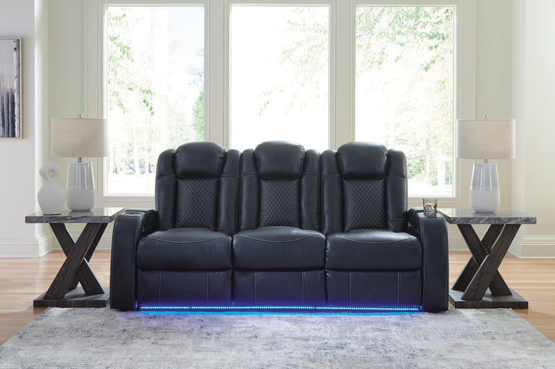 Ashley Furniture Fyne-Dyme Power Reclining Sofa with plush cushions and reclining features, shown in a modern living room setting.