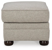 Ashley Furniture Gaelon Ottoman featuring a plush fabric and modern design, shown from a side angle.