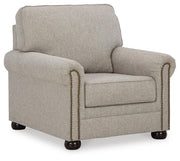 Ashley Furniture Gaelon Chair with plush upholstered seat and wooden legs, shown from an angled side view.