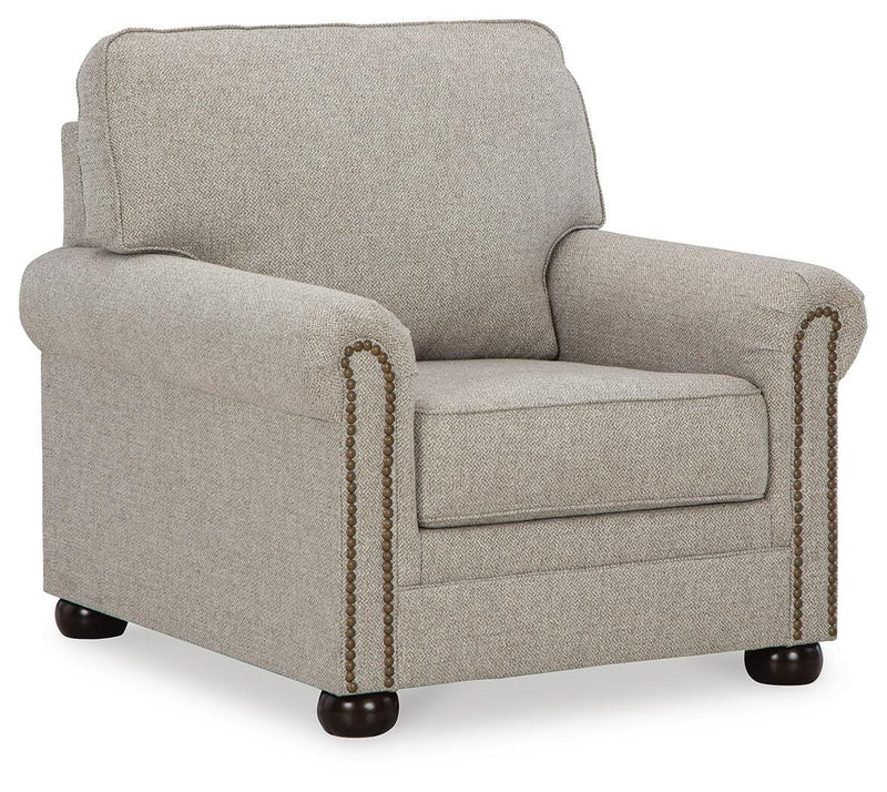 Ashley Furniture Gaelon Chair with plush upholstered seat and wooden legs, shown from an angled side view.