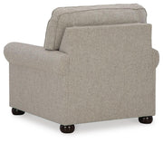 Ashley Furniture Gaelon Chair with black fabric upholstery and wooden legs, shown from the back in a modern living room setting.