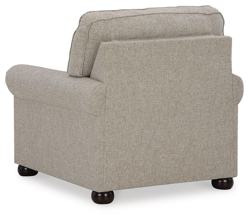 Ashley Furniture Gaelon Chair with black fabric upholstery and wooden legs, shown from the back in a modern living room setting.