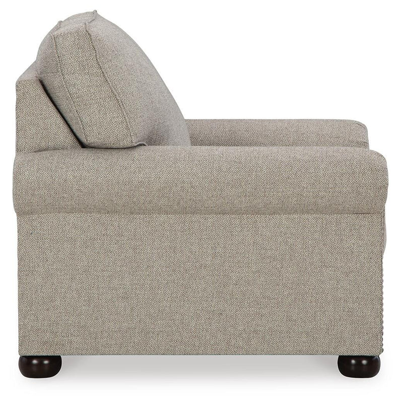 Ashley Furniture Gaelon Chair with wooden legs and plush upholstery, shown from a side angle on a plain background.