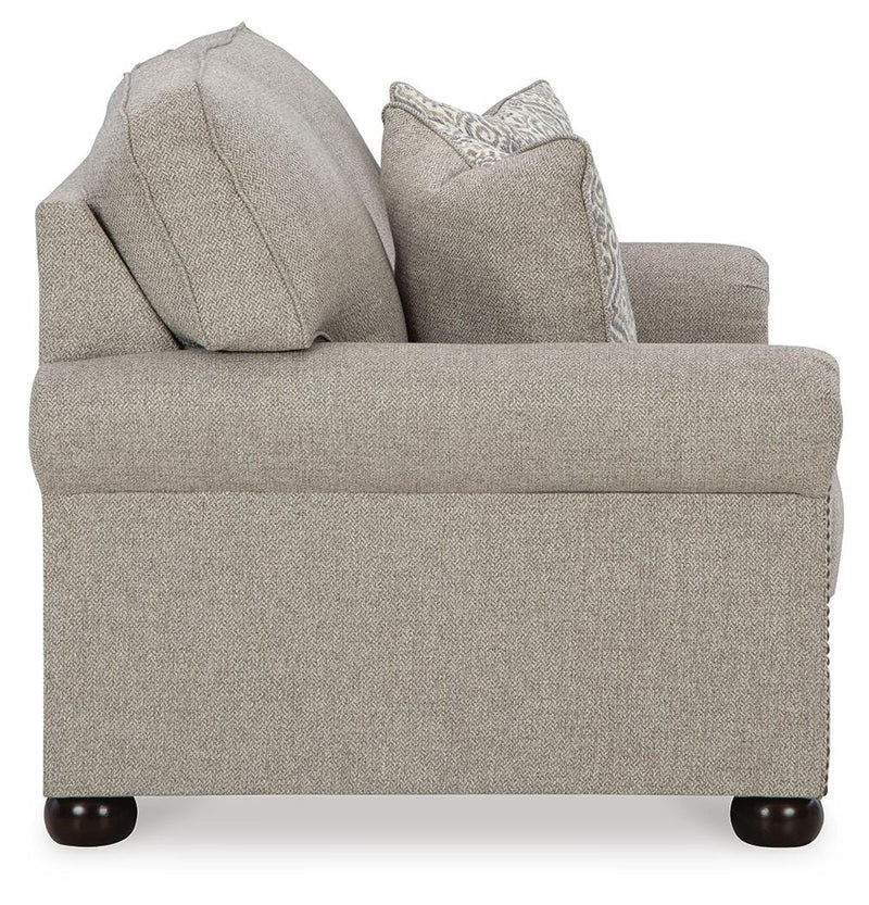 Ashley Furniture Gaelon Loveseat with plush fabric and modern design, shown from a side angle in the image.