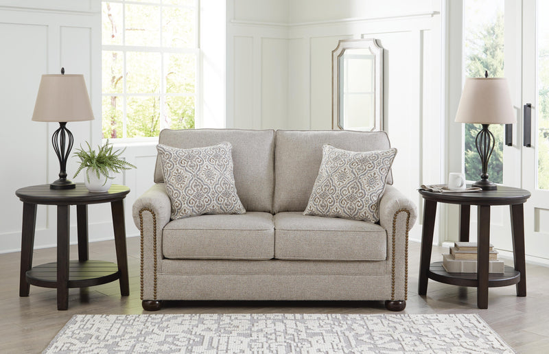 Ashley Furniture Gaelon Loveseat with plush fabric and modern design, featuring soft cushions and sleek armrests.