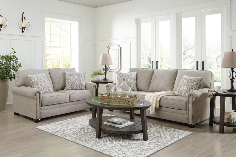 Ashley Furniture Gaelon living room set with sofa, loveseat, and coffee table arranged in modern living space.