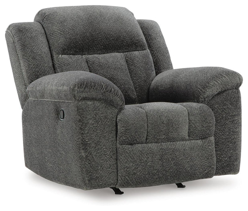 Ashley Furniture Frohn recliner in tan fabric, shown from an angle with closed footrest and cushioned armrests.