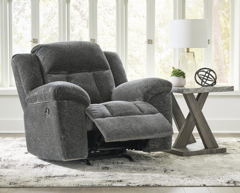 Open view of Ashley Furniture Frohn Recliner showing plush cushions and reclining mechanism in a cozy living room setting.