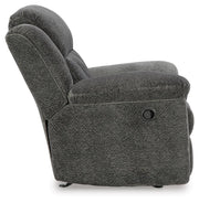 Ashley Furniture Frohn recliner with plush fabric and padded armrests, shown from the side in a modern living room setting.