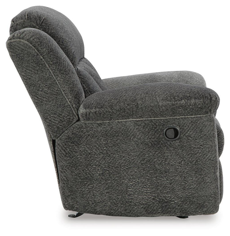 Ashley Furniture Frohn recliner with plush fabric and padded armrests, shown from the side in a modern living room setting.