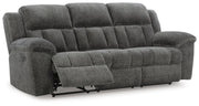 Ashley Furniture Frohn reclining sofa with plush cushions and extended footrest, shown from an angled open view.