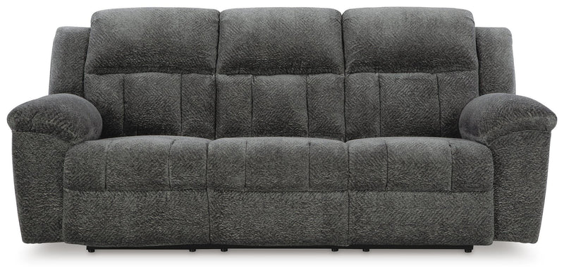 Ashley Furniture Frohn reclining sofa with plush cushions and dark upholstery, shown from a front head-on view.