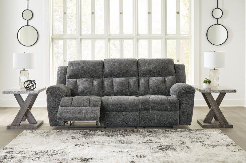 Open view of Ashley Furniture Frohn reclining sofa showing plush cushions and reclining feature in a modern living room setting.