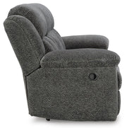 Ashley Furniture Frohn reclining sofa with plush cushions and reclining features, shown in a modern living room setting.