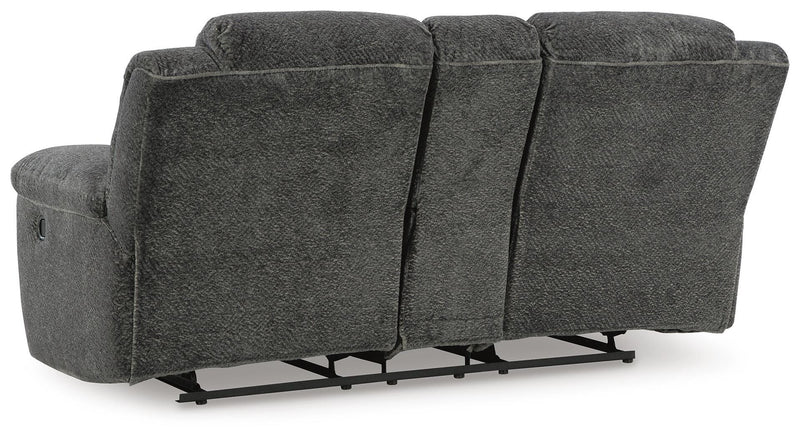 Ashley Furniture Frohn reclining loveseat with built-in console, showing plush upholstery and ergonomic design for comfortable seating.