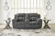 Frohn reclining loveseat with console by Ashley Furniture, featuring plush fabric, padded armrests, and built-in cup holders.