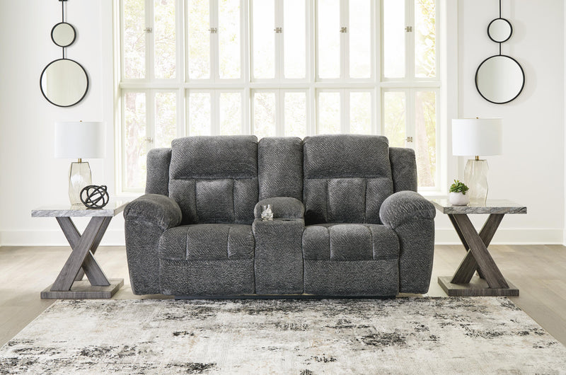 Frohn reclining loveseat with console by Ashley Furniture, featuring plush fabric, padded armrests, and built-in cup holders.