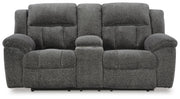 Ashley Furniture Frohn reclining loveseat with built-in console, featuring plush cushions and a modern design.