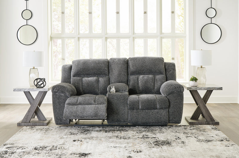 Ashley Furniture Frohn reclining loveseat with built-in console, featuring plush fabric and padded armrests, shown in an open position.