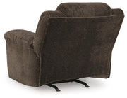 Ashley Furniture Frohn recliner with plush fabric and cushioned armrests, shown in a relaxed seated position.