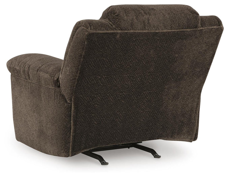 Ashley Furniture Frohn recliner with plush fabric and cushioned armrests, shown in a relaxed seated position.