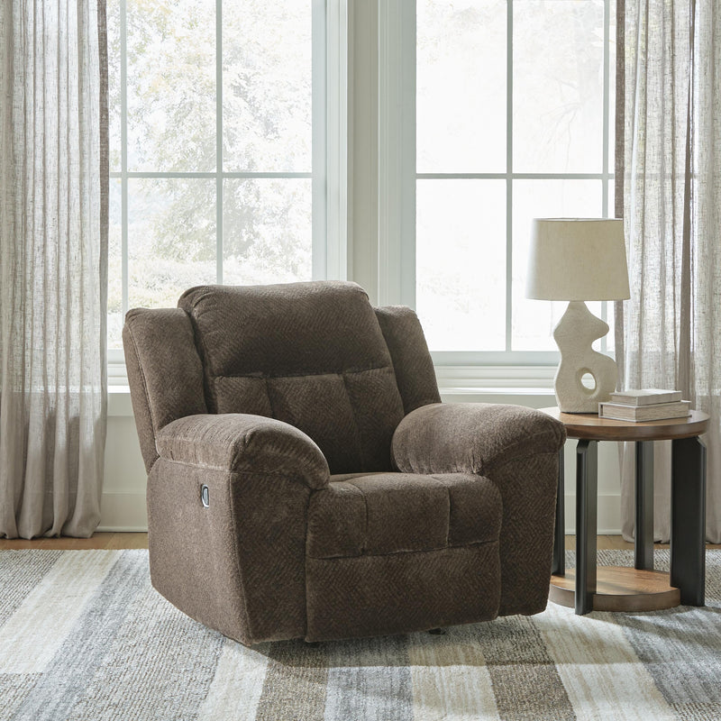 Ashley Furniture Frohn recliner with plush cushioning and wood legs, shown in a closed position in a cozy living room setting.