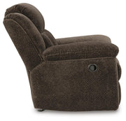 Ashley Furniture Frohn recliner with plush upholstery and padded armrests, shown from a side view.