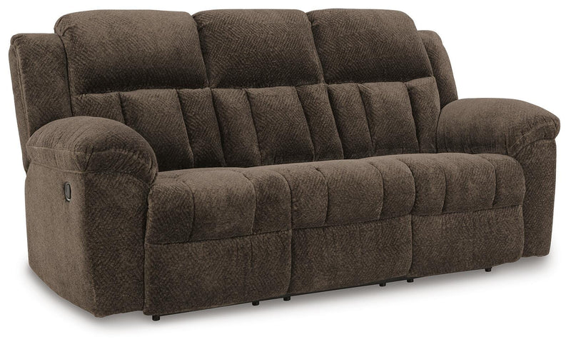 Ashley Furniture Frohn reclining sofa with plush cushions and fabric upholstery, shown from an angled view in the image.
