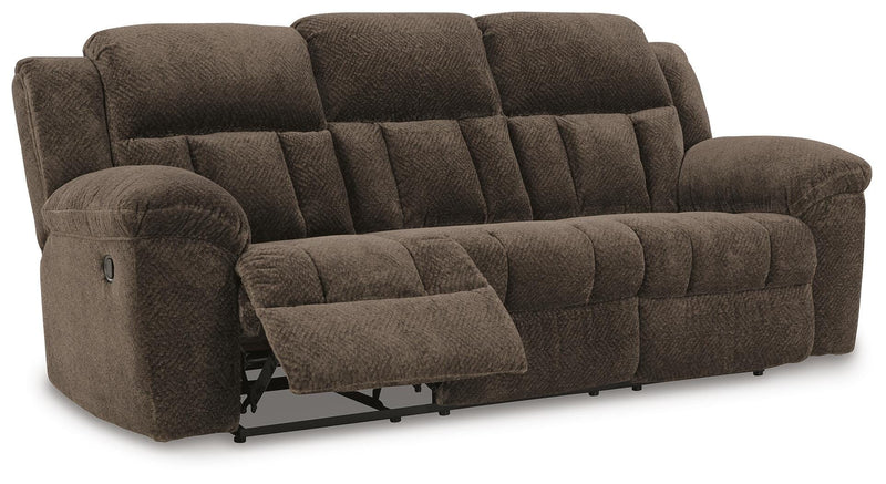 Ashley Furniture Frohn reclining sofa shown from an angled open view, showcasing plush cushions and reclining feature.