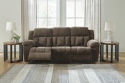 Ashley Furniture Frohn reclining sofa with plush cushions and reclining features, shown in an open position.