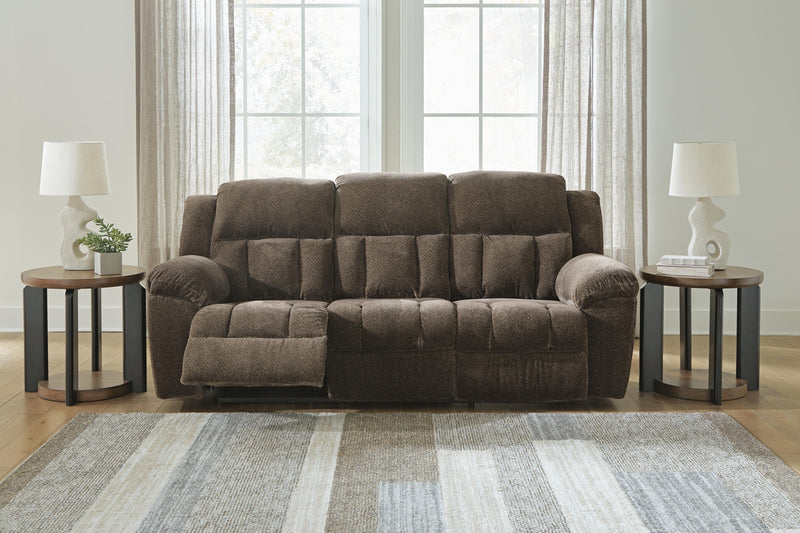 Ashley Furniture Frohn reclining sofa with plush cushions and reclining features, shown in an open position.