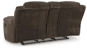 Ashley Furniture Frohn reclining loveseat with built-in console, showcasing plush fabric, cushioned armrests, and ergonomic design.