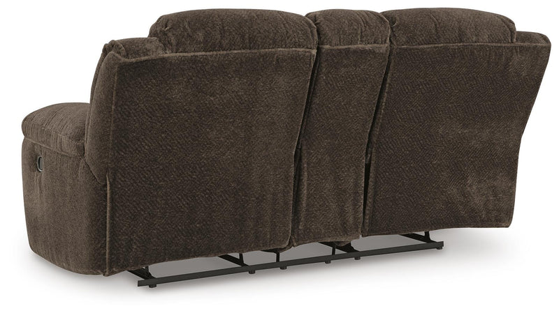 Ashley Furniture Frohn reclining loveseat with built-in console, showcasing plush fabric, cushioned armrests, and ergonomic design.