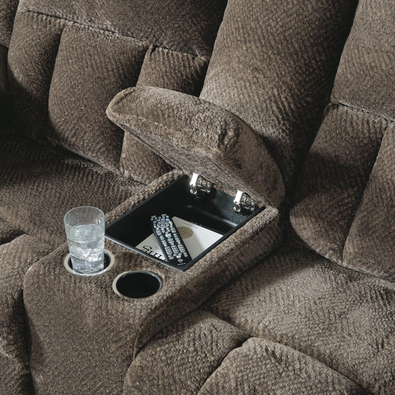 Close-up of Ashley Furniture Frohn reclining loveseat with built-in console and plush fabric upholstery.