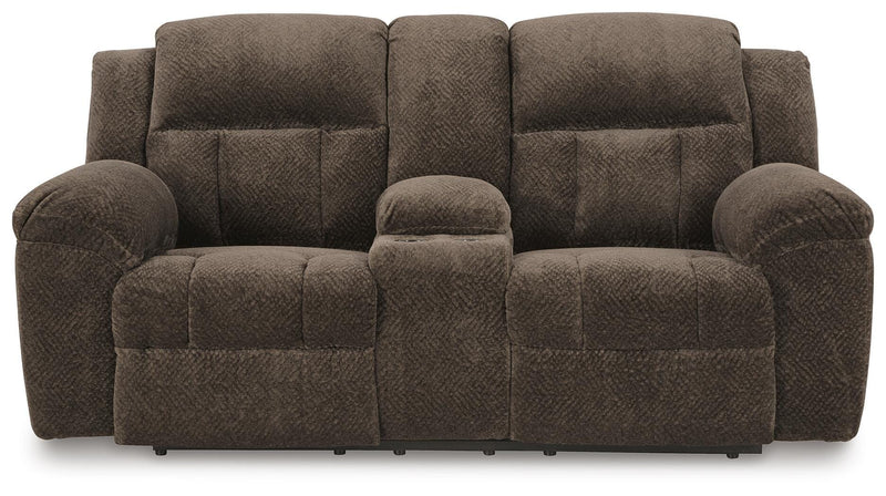 Ashley Furniture Frohn reclining loveseat with console, featuring plush fabric, padded armrests, and built-in cup holders.
