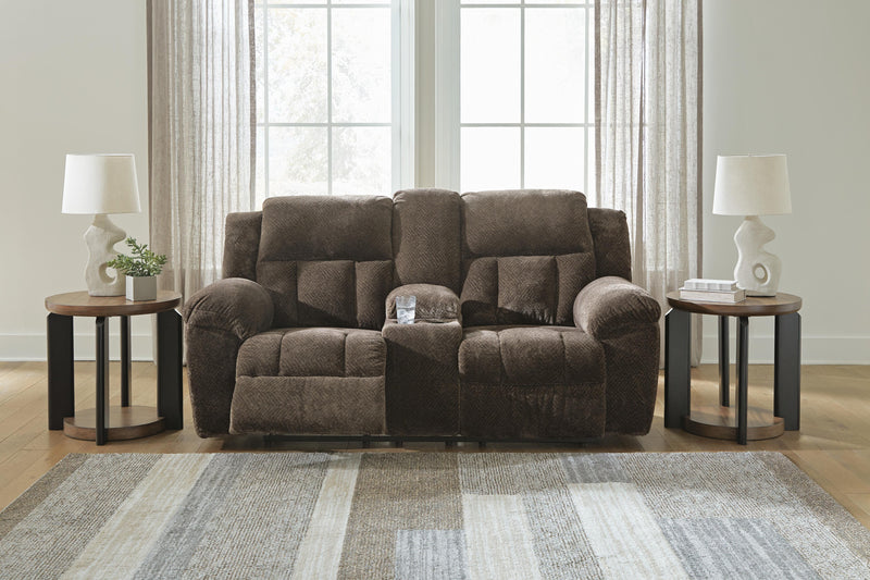 Open view of Ashley Furniture Frohn reclining loveseat with built-in console, featuring plush fabric and padded armrests.