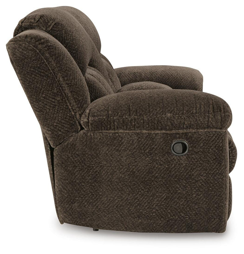 Ashley Furniture Frohn reclining loveseat with console, featuring plush upholstery and side view with built-in cup holders.