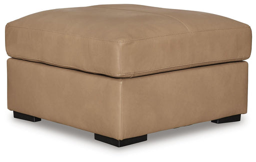 Ashley Furniture Bandon oversized accent ottoman with plush fabric and contemporary design, shown from an angled view.