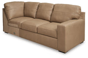 Ashley Furniture Bandon Sectional sofa with plush cushions and modern design, shown from an angled view in the image.