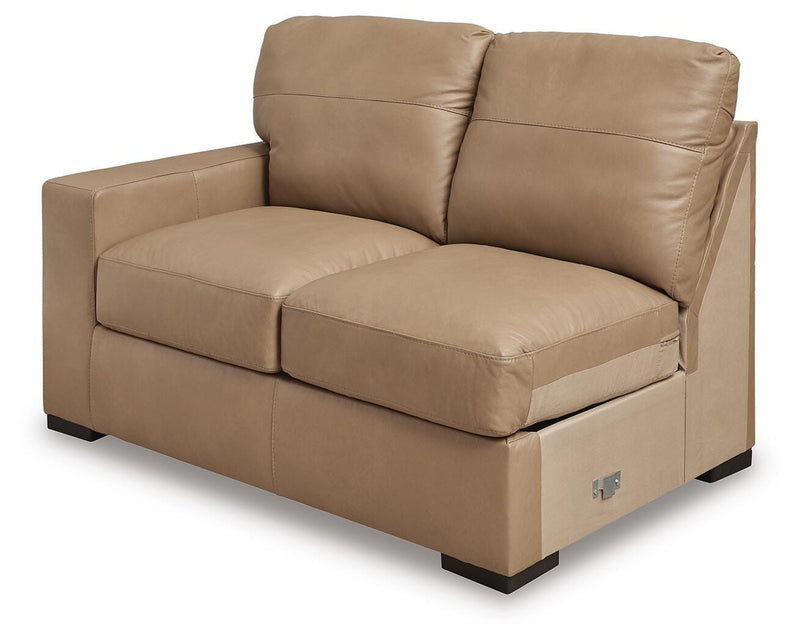 Ashley Furniture Bandon sectional sofa shown in an angled view with plush cushions and modern design.