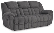 Ashley Furniture Foreside Reclining Sofa in a stylish fabric, shown from an angled side view with the reclined feature visible.