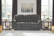 Ashley Furniture Foreside Reclining Sofa with plush cushions and reclining features, shown in a modern living room setting.