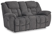 Ashley Furniture Foreside Reclining Loveseat with Console, plush fabric, and built-in cup holders, viewed from an angle.
